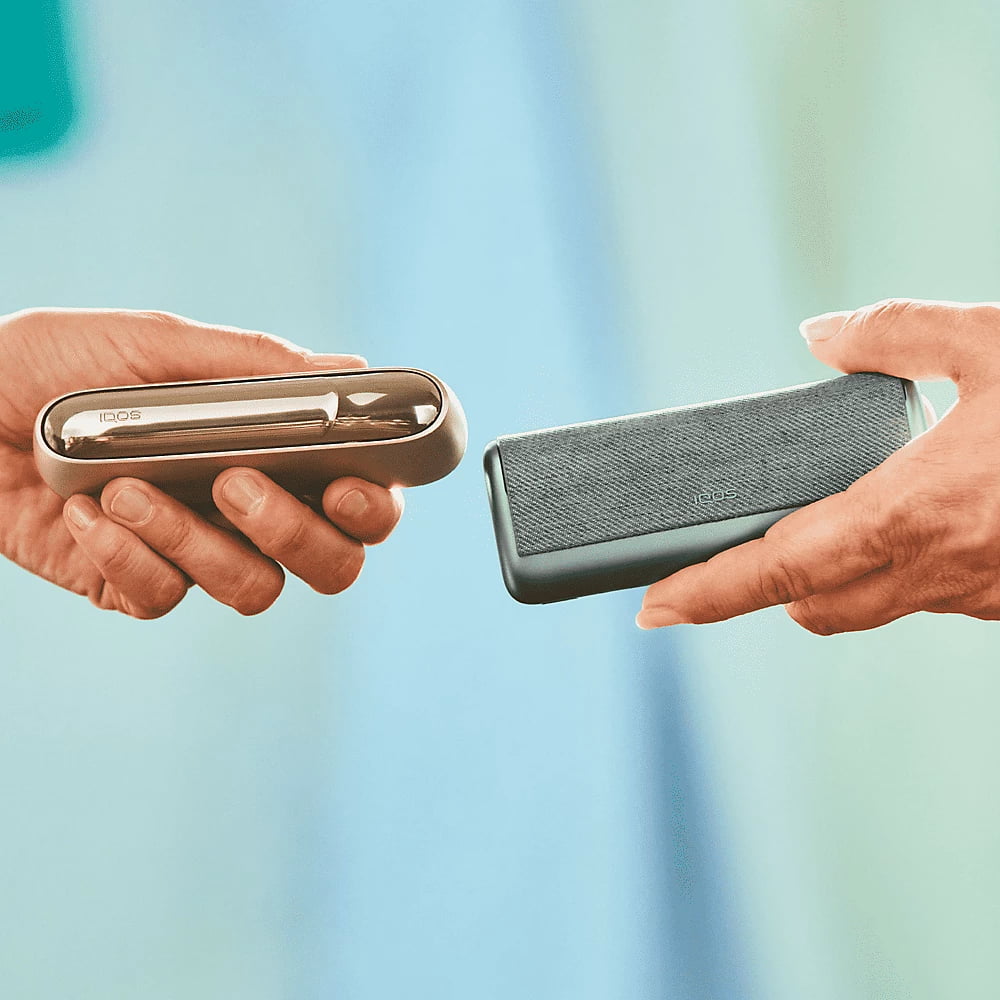 An IQOS DUO and an IQOS ILUMA PRIME being compared